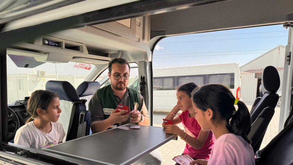 Children take part in art and play activities inside a Turkish Green Crescent (Yeşilay) caravan set up in a container city, Hatay, Türkiye, Oct. 9, 2025. (AA Photo)