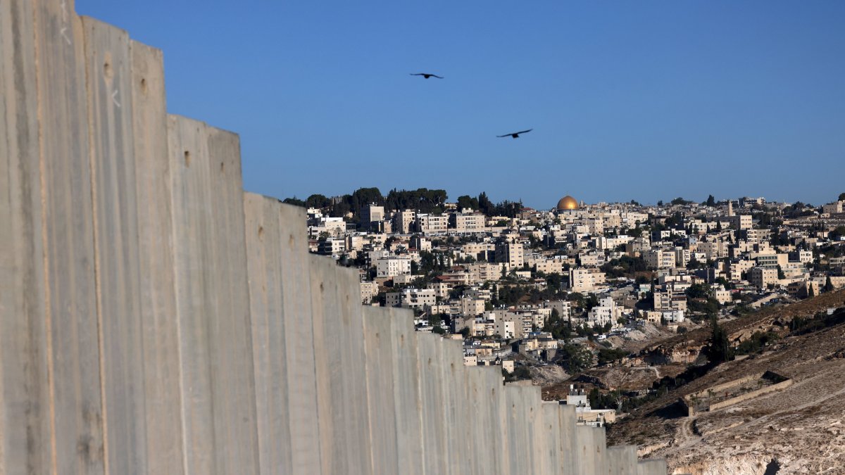 The Dome of the Rock Mosque and surrounding buildings are pictured from the Palestinian city of Abu Dis in the occupied West Bank, with Israel&#039;s West Bank separation barrier in the foreground, Oct. 7, 2025. (EPA Photo)