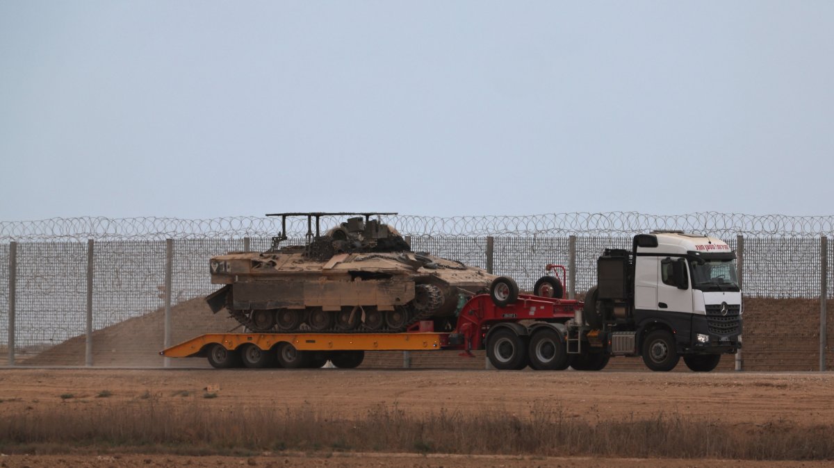 An Israeli military truck carrying APCs leaving the Gaza Strip after the Trump announcement on the Israel-Hamas agreement on the first phase of a Gaza peace plan, Oct. 9, 2025. (EPA Photo)