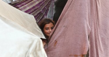 A Palestinian girl reacts while sheltering at a tent, after Israel and Hamas agreed on the first phase of a Gaza cease-fire, in Khan Younis, southern Gaza Strip, Oct. 9, 2025. (Reuters Photo)