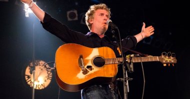 Irish singer Glen Hansard performs live on stage at the Down the Rabbit Hole Festival, Beuningen, the Netherlands, June 25, 2016. (Shutterstock Photo)