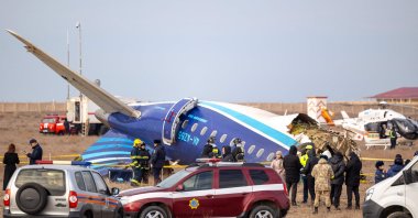 Emergency specialists work at the crash site of an Azerbaijan Airlines passenger jet near the western Kazakh city of Aktau, Dec. 25, 2024. (AFP File Photo)