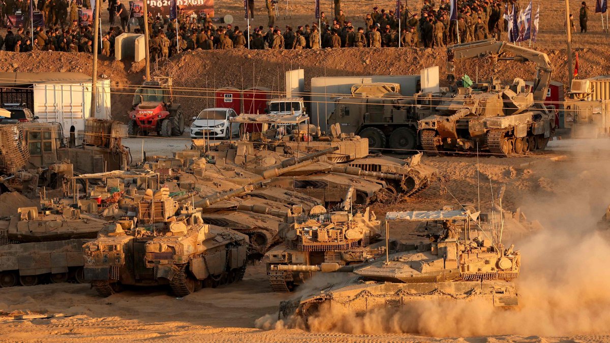 Israeli troops gather at a position along the Israel-Gaza border fence, Oct. 10, 2025. (AFP Photo)