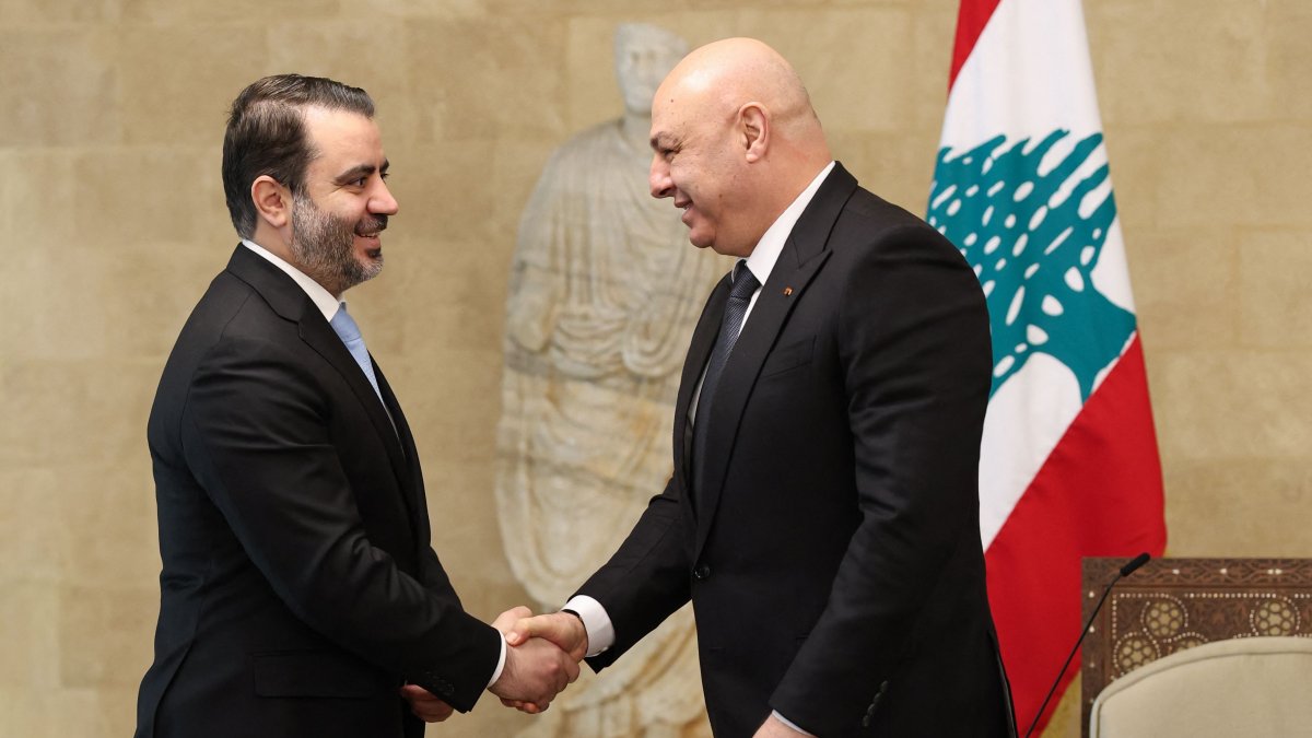 Lebanon&#039;s President Joseph Aoun greets Syria&#039;s Foreign Minister Asaad al-Shaibani before a meeting at the presidential palace in Baabda, east of Beirut. (Photo by Lebanese Presidency via AFP)