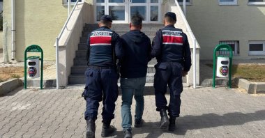 Gendarmerie officers escort a fugitive convicted of membership in the Gülenist Terror Group (FETÖ) terrorist group, Kırıkkale, Türkiye, Oct. 3, 2025. (IHA Photo)