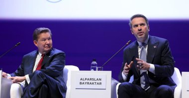 Alexei Miller, CEO of Russian gas corporation Gazprom, listens as Energy and Natural Resources Minister Alparslan Bayraktar (R) speaks during the plenary session &quot;Natural Gas Market In 2025-2035: New Contours In Fast-Moving Environment&quot; at the St. Petersburg International Gas Forum (SPIGF), St. Petersburg, Russia, Oct. 9, 2025. (AA Photo)