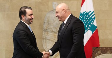 Lebanon&#039;s President Joseph Aoun greets Syria&#039;s Foreign Minister Asaad al-Shaibani before a meeting at the presidential palace in Baabda, east of Beirut. (Photo by Lebanese Presidency via AFP)