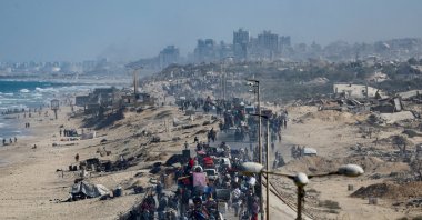 Palestinians, who were displaced to the southern part of Gaza at Israel&#039;s order, make their way along a road as they return to the north, amid a ceasefire between Israel and Hamas in Gaza, in the central Gaza Strip, Oct. 11, 2025. (Reuters Photo)
