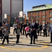 National Education Minister Yusuf Tekin plays games with students during his visit to Şehit Murat Ellik Primary School in Erzurum, eastern Türkiye, Oct. 7, 2025. (AA Photo)