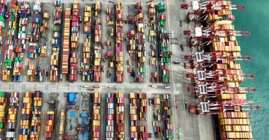 A ship is seen at the container terminal of the port in Qingdao, China, Oct. 9, 2025. (AFP Photo)