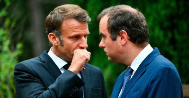 France&#039;s President Emmanuel Macron speaks with France&#039;s outgoing Minister for the Armed Forces Sebastien Lecornu during a ceremony marking the 80th anniversary of the Allied landings in Provence during World War II, at the Boulouris National Cemetery (&quot;necropole nationale&quot;) in Boulouris-sur-Mer, south eastern France, Aug. 15, 2024. (AFP Photo)
