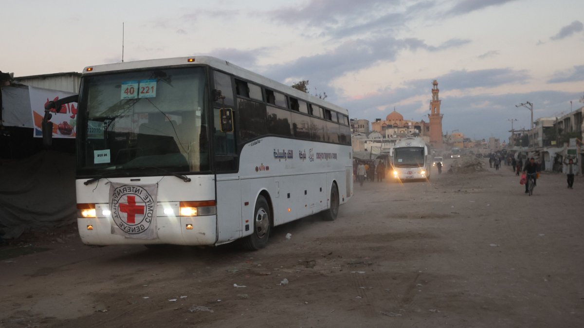 Buses with the International Red Cross emblem on them move towards the eastern Gaza Strip from Khan Yunis in southern Gaza on October 13, 2025, ahead of the release of Israeli hostages held by Hamas. (AFP Photo)