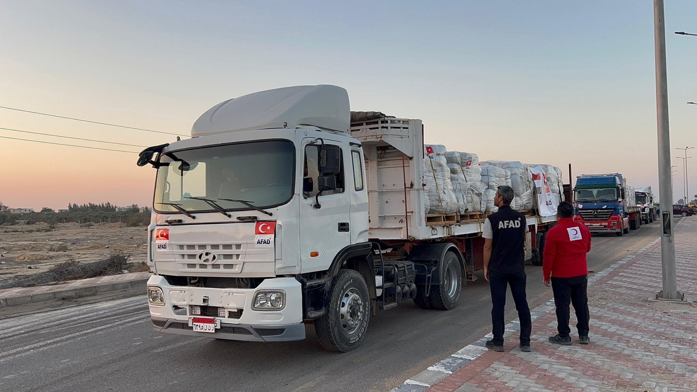Disaster and Emergency Management Authority (AFAD) trucks carrying aid await before proceeding toward the Rafah border crossing, between Egypt and the Gaza Strip, Rafah, North Sinai, Egypt, Oct. 12, 2025. (AA Photo)