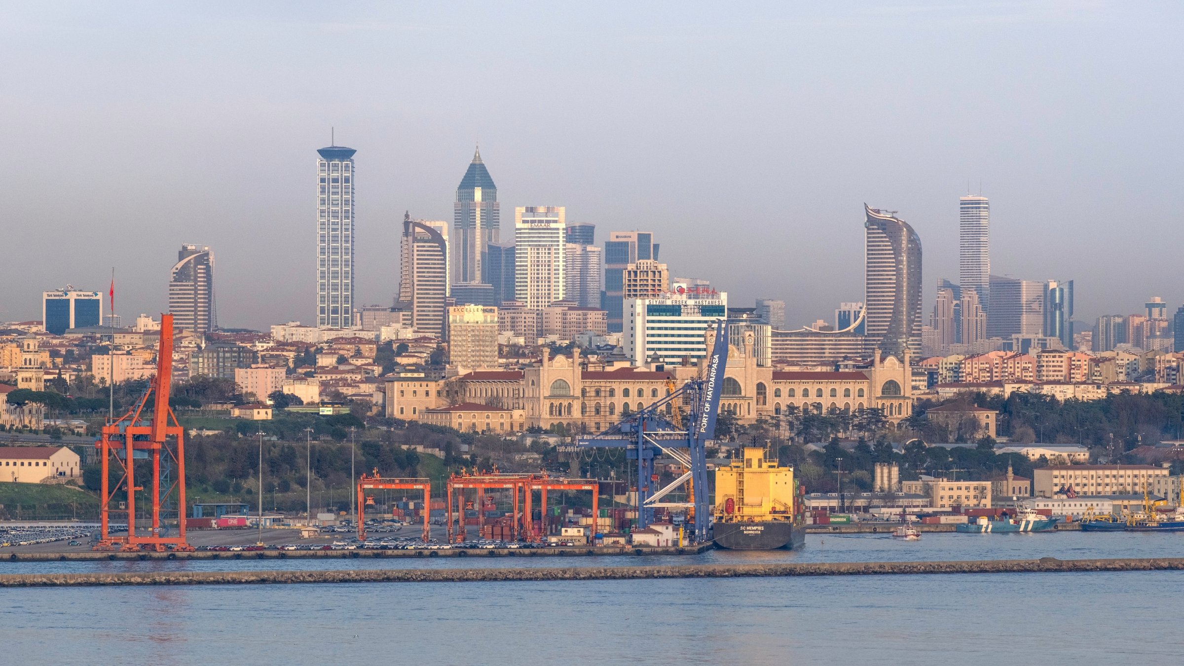 A port is seen with residential buildings and skyscrapers in the background in Istanbul, Türkiye, March 26, 2025. (Shutterstock Photo)