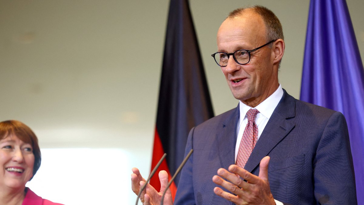 German Chancellor Friedrich Merz and President of the German Association of the Automotive Industry (VDA) Hildegard Mueller give a statement following a meeting of top carmakers at the Chancellery in Berlin, Germany, Oct. 9, 2025. (Reuters Photo)