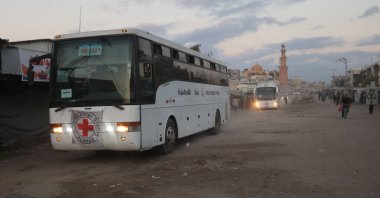Buses with the International Red Cross emblem on them move towards the eastern Gaza Strip from Khan Yunis in southern Gaza on October 13, 2025, ahead of the release of Israeli hostages held by Hamas. (AFP Photo)