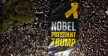 A drone photo of people gathering in &quot;Hostages square&quot; as they hold up a giant sign with the words &quot;Nobel President Trump&quot; written on it, after a cease-fire between Israel and Hamas in Gaza went into effect, Tel Aviv, Israel, Oct.11, 2025. (Reuters Photo)