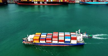 A container ship sails at the port in Qingdao, China, Oct. 9, 2025. (AFP Photo)