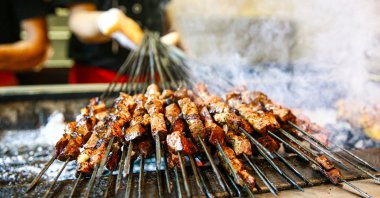 Adana kebabs sizzle on a traditional charcoal grill, Adana, Türkiye, Oct. 4, 2025. (AA Photo)