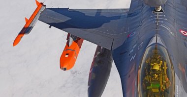 This file photo shows a fighter jet equipped with a SOM cruise missile (C). (Courtesy of TUBITAK SAGE)