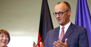 German Chancellor Friedrich Merz and President of the German Association of the Automotive Industry (VDA) Hildegard Mueller give a statement following a meeting of top carmakers at the Chancellery in Berlin, Germany, Oct. 9, 2025. (Reuters Photo)