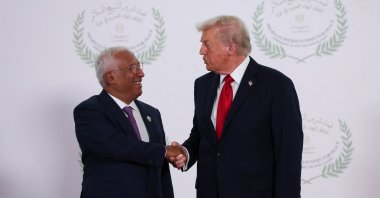 U.S. President Donald Trump and European Council President Antonio Costa shake hands as they pose for a photo, at a world leaders' summit on ending the Gaza war,  in Sharm el-Sheikh, Egypt, Oct. 13, 2025. (Reuters Photo)