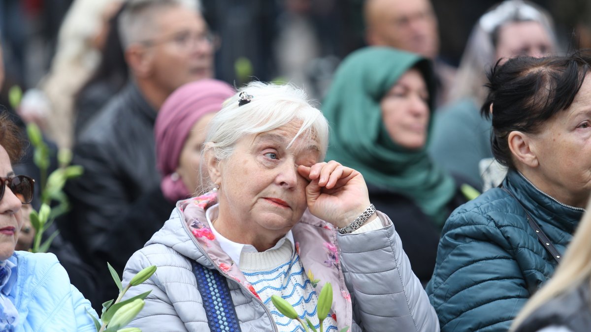 A woman wipes a tear as thousands of people bid farewell to Halid Beslic, the renowned Bosnian folk singer who passed away on Oct. 7, Sarajevo, Bosnia-Herzegovina, Oct. 13, 2025. (AA Photo)
