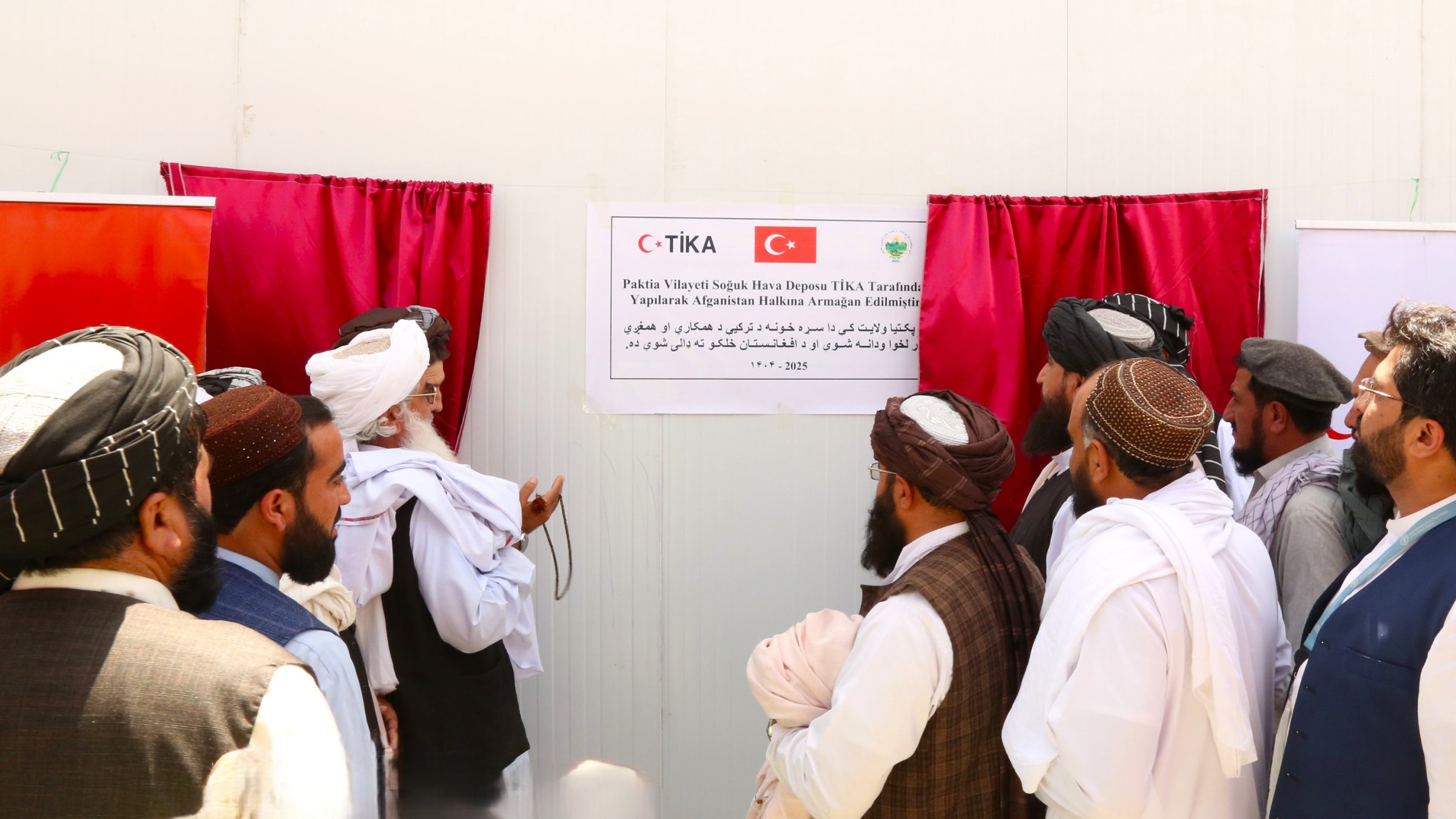 Farmers inspect produce at a newly opened 300-ton cold storage facility in Paktiya, Afghanistan, Oct. 14, 2025. (AA Photo)