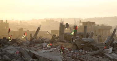 Palestinian flags flutter on top of rubble, Gaza City, Palestine, Oct. 12, 2025. (AFP Photo)
