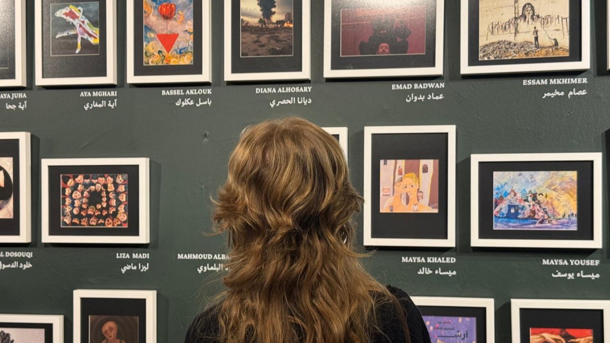 A visitor explores the Gaza Biennale, Istanbul, Türkiye, Sept. 24, 2025. (AA Photo)