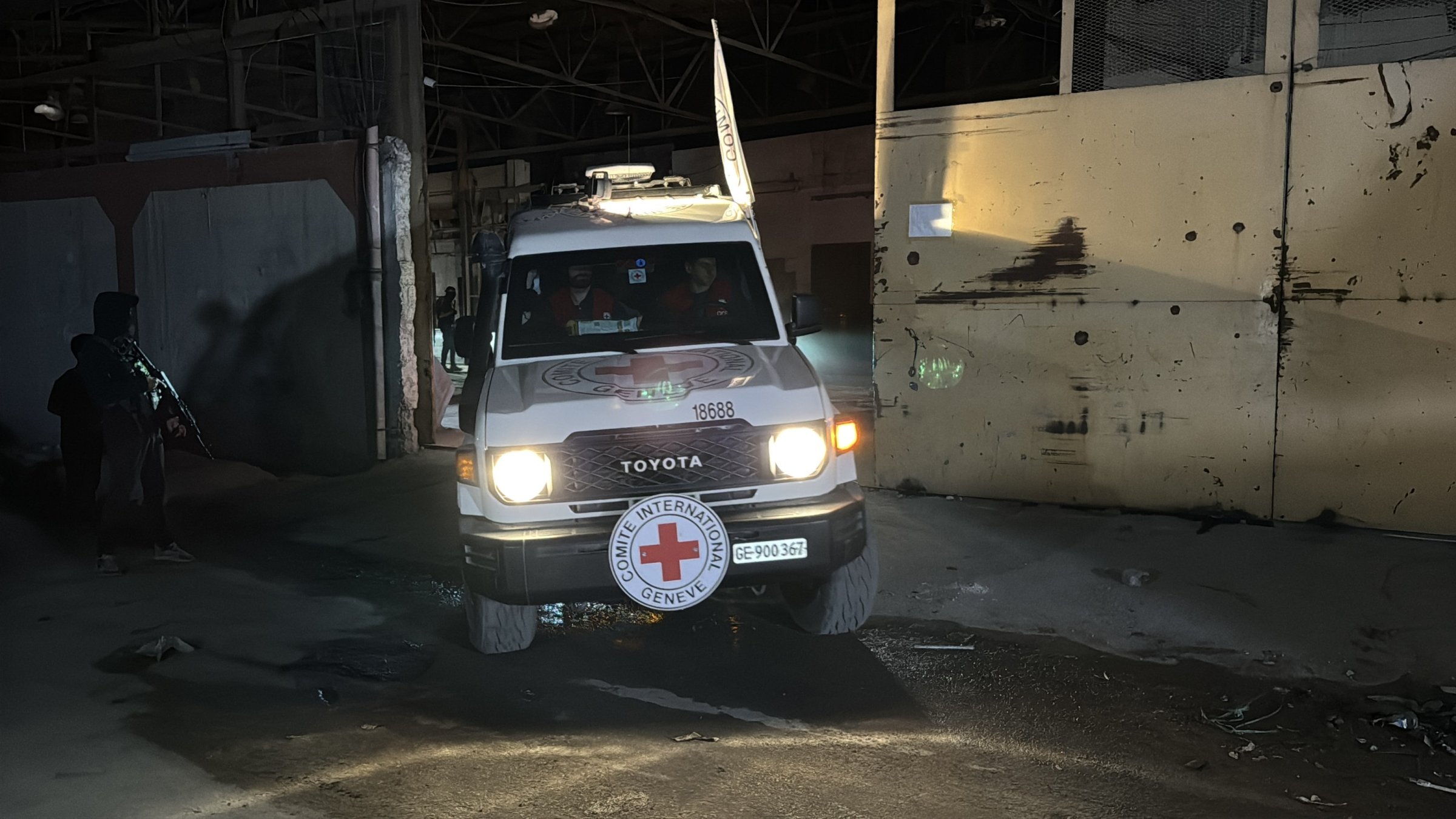 An ICRC vehicle carrying the body of a former captive is seen in Gaza, Oct. 14, 2025. (AA Photo)