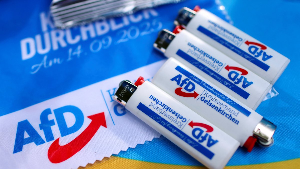 Promotional items lie on a table of an election campaign booth as Norbert Emmerich, candidate for Gelsenkirchen mayor from the Alternative for Germany party (AfD), campaigns on the streets ahead of the runoff of the North Rhine-Westphalian (NRW) local elections, in Gelsenkirchen, Germany, Sept. 24, 2025. (Reuters File Photo)