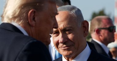 Israeli Prime Minister Benjamin Netanyahu looks on next to U.S. President Donald Trump as Trump leaves Israel to attend a world leaders&#039; summit on ending the Gaza war, Ben Gurion International Airport, Lod, Israel, Oct. 13, 2025. (Reuters Photo)
