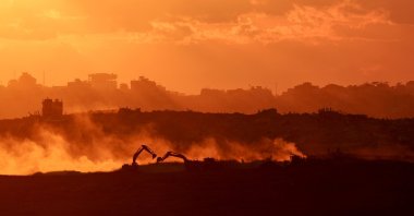 Dust rises as Israeli troops move in the northern part of the Gaza Strip, Palestine, as seen from the Israeli side of the border, following the Israel-Hamas agreement, Oct. 14, 2025. (EPA Photo)