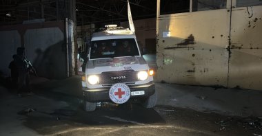 An ICRC vehicle carrying the body of a former captive is seen in Gaza, Oct. 14, 2025. (AA Photo)