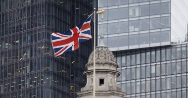 The U.K. flag flies at the City of London financial district, London, U.K., Sept. 18, 2025. (EPA Photo)