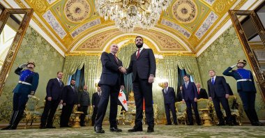 Russian President Vladimir Putin (L) and Syrian interim President Ahmed al-Sharaa shake hands during their meeting at the Grand Kremlin Palace in Moscow, Russia, Oct. 15, 2025. (EPA Photo)
