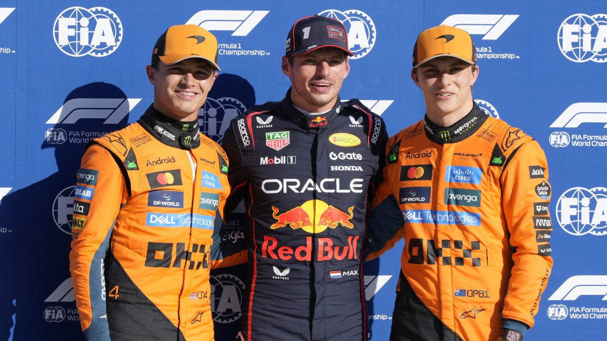 Red Bull driver Max Verstappen (C), celebrates his pole position with McLaren drivers Lando Norris (L) and Oscar Piastri after the qualifying session ahead of the Italian Grand Prix at the Monza racetrack, Monza, Italy, Sept. 6, 2025. (AP Photo)