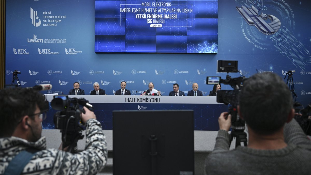 Media members take a photo of tender commission during the tender for authorization for the establishment, operation and provision of 5G mobile services at the Information and Communication Technologies Authority (BTK) headquarters, Ankara, Türkiye, Oct. 16, 2025. (AA Photo)