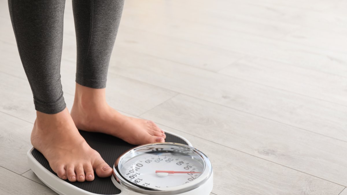 Measuring weight regularly is an important part of monitoring progress during obesity treatment. (Shutterstock Photo)