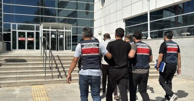 Two Daesh suspects are being detained by security forces in Adıyaman province, Türkiye, Oct. 2, 2025 (AA Photo)