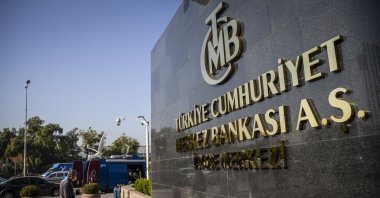A man passes by the headquarters of the Central Bank of the Republic of Türkiye (CBRT), Ankara, Türkiye, Oct. 28, 2021. (AA File Photo)