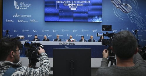 Media members take a photo of tender commission during the tender for authorization for the establishment, operation and provision of 5G mobile services at the Information and Communication Technologies Authority (BTK) headquarters, Ankara, Türkiye, Oct. 16, 2025. (AA Photo)