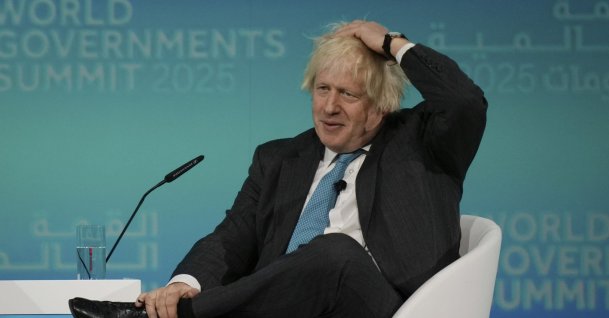 Former British Prime Minister Boris Johnson gestures as he talks to CNN anchor Richard Quest during the World Governments Summit in Dubai, United Arab Emirates, Feb. 12, 2025. (AP Photo)