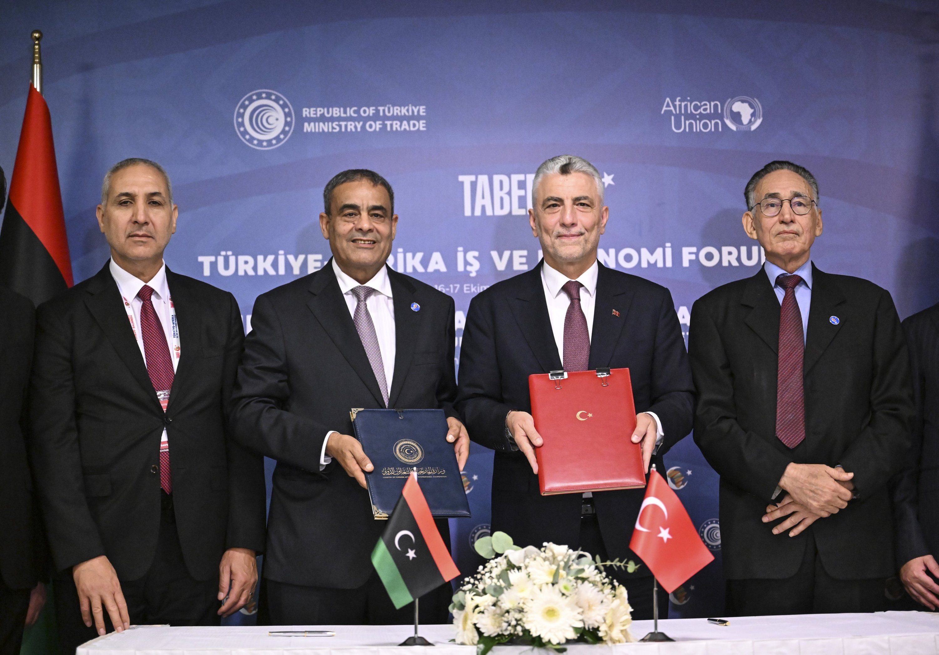 Trade Minister Ömer Bolat (2nd R), his Libyan counterpart Muhammad al-Hawij (R) and Libyan Transport Minister Muhammad Salem Al-Shahoubi (2nd L) pose for a photo after agreement signings, Istanbul, Türkiye, Oct. 16, 2025. (AA Photo)
