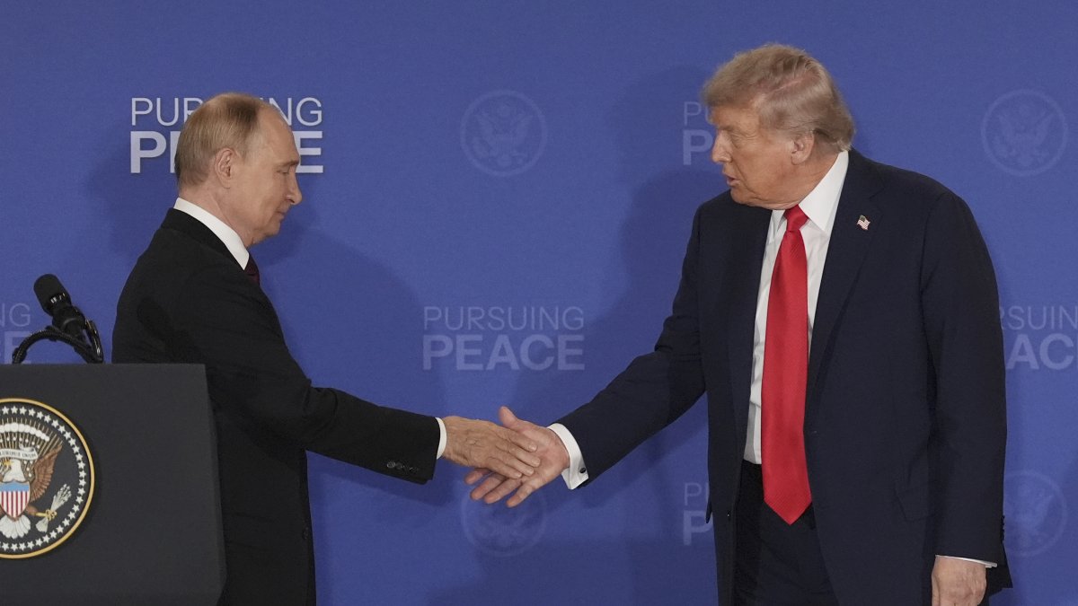 U.S. President Donald Trump (R) shakes the hand of Russia's President Vladimir Putin during a joint press conference at Joint Base Elmendorf-Richardson, Alaska, U.S., Aug. 15, 2025. (AP Photo)