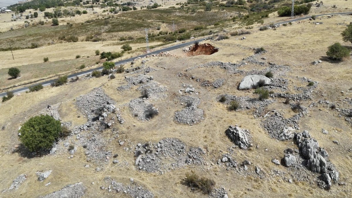 An aerial view of a mountainous area where archaeologists have uncovered grape-processing installations, cisterns, grinding stones, and building foundations dating back to the A.D. fourth century, Adıyaman, southeastern Turkiye, Sept. 4, 2025. (AA Photo)