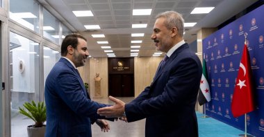 Foreign Minister Hakan Fidan and Syrian Foreign Minister Asaad al-Shaibani shake hands, Ankara, Oct. 12, 2025. (DHA File Photo)
