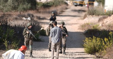 Israeli soldiers open fire on Palestinian farmers trying to reach their land for the olive harvest in the village of Kobar, near Ramallah in the occupied West Bank, Oct. 18, 2025. (AA Photo)