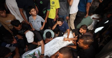 Mourners surround the body of a Palestinian released by Israel under a Gaza ceasefire and hostage exchange, before his funeral in the Bureij refugee camp in the central Gaza Strip, Oct. 18, 2025. (AFP Photo)